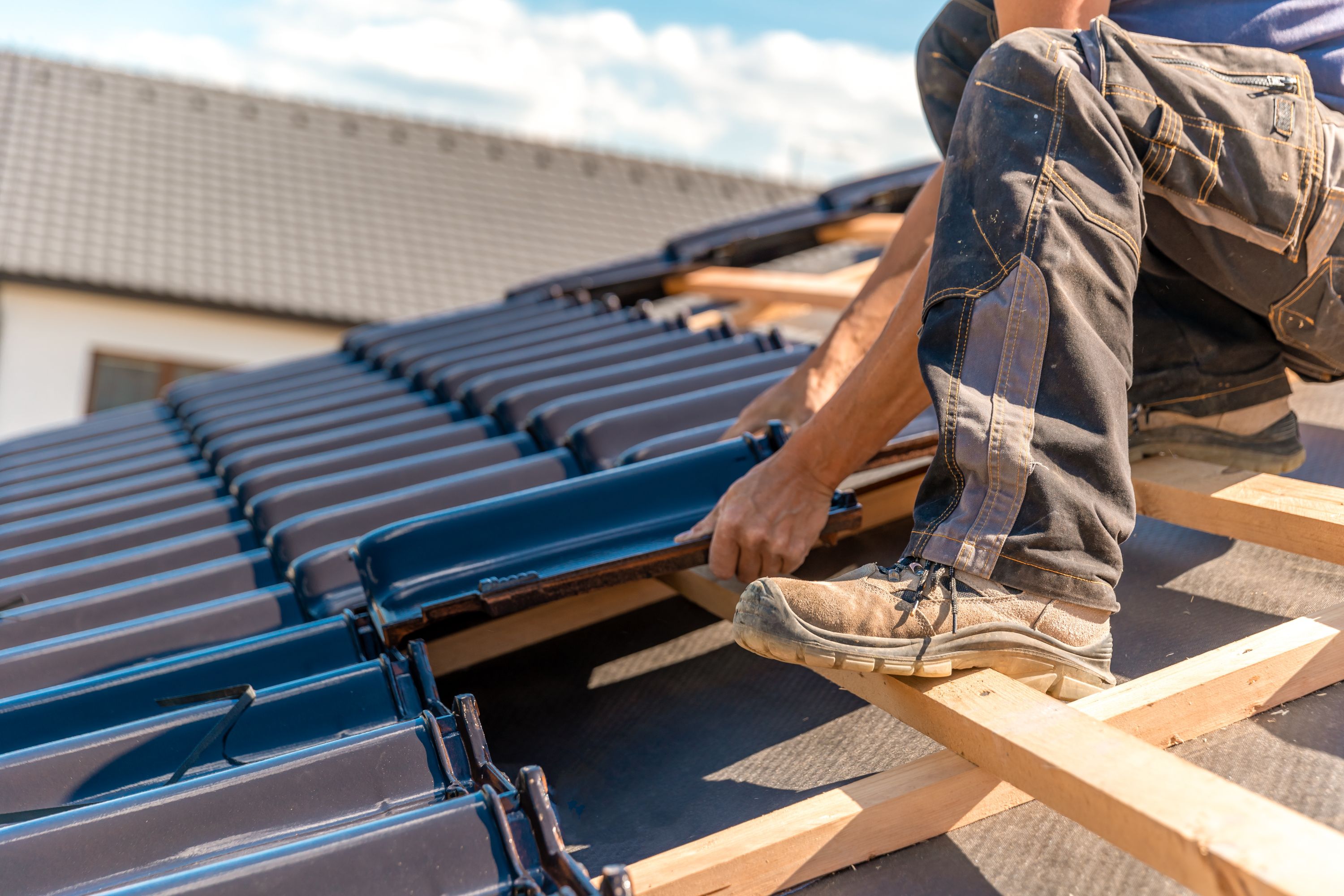 Man on roof working